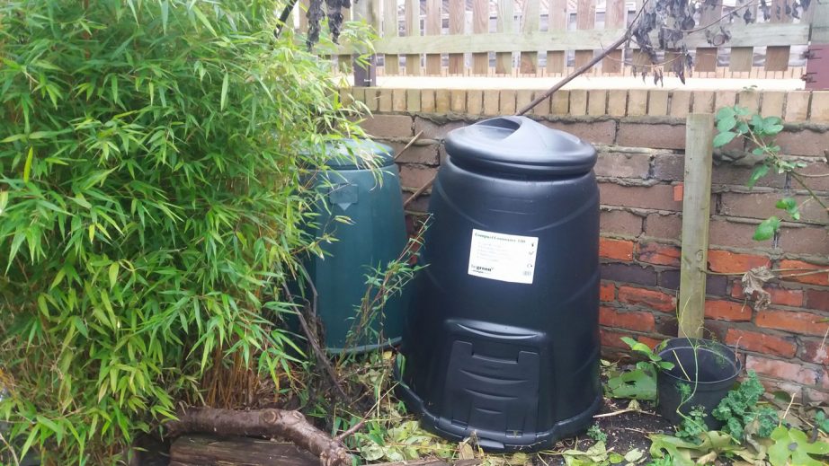 compost bins in a tiny garden